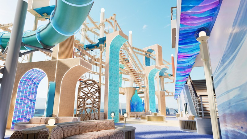 A wide editorial travel photograph looking up at a multi-level open-air waterslide and splash pad complex on the upper decks of a cruise ship, with colorful slides, water features, and blue sky overhe
