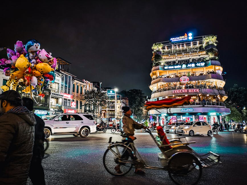 Explore the bustling nightlife of Hanoi with colorful balloons, busy streets, and lively architecture.