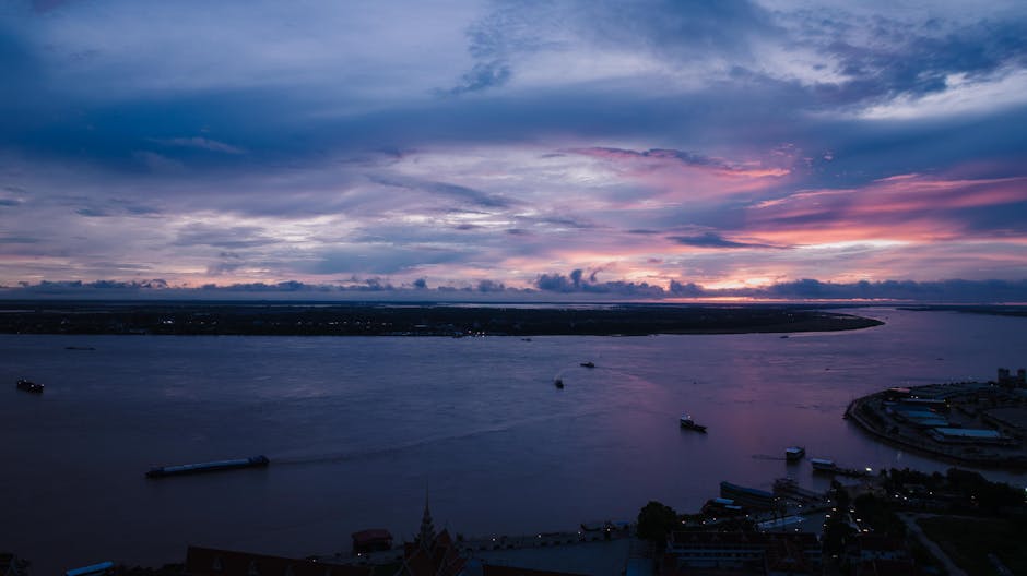 A breathtaking aerial view of sunset over the river in Phnom Penh, Cambodia.