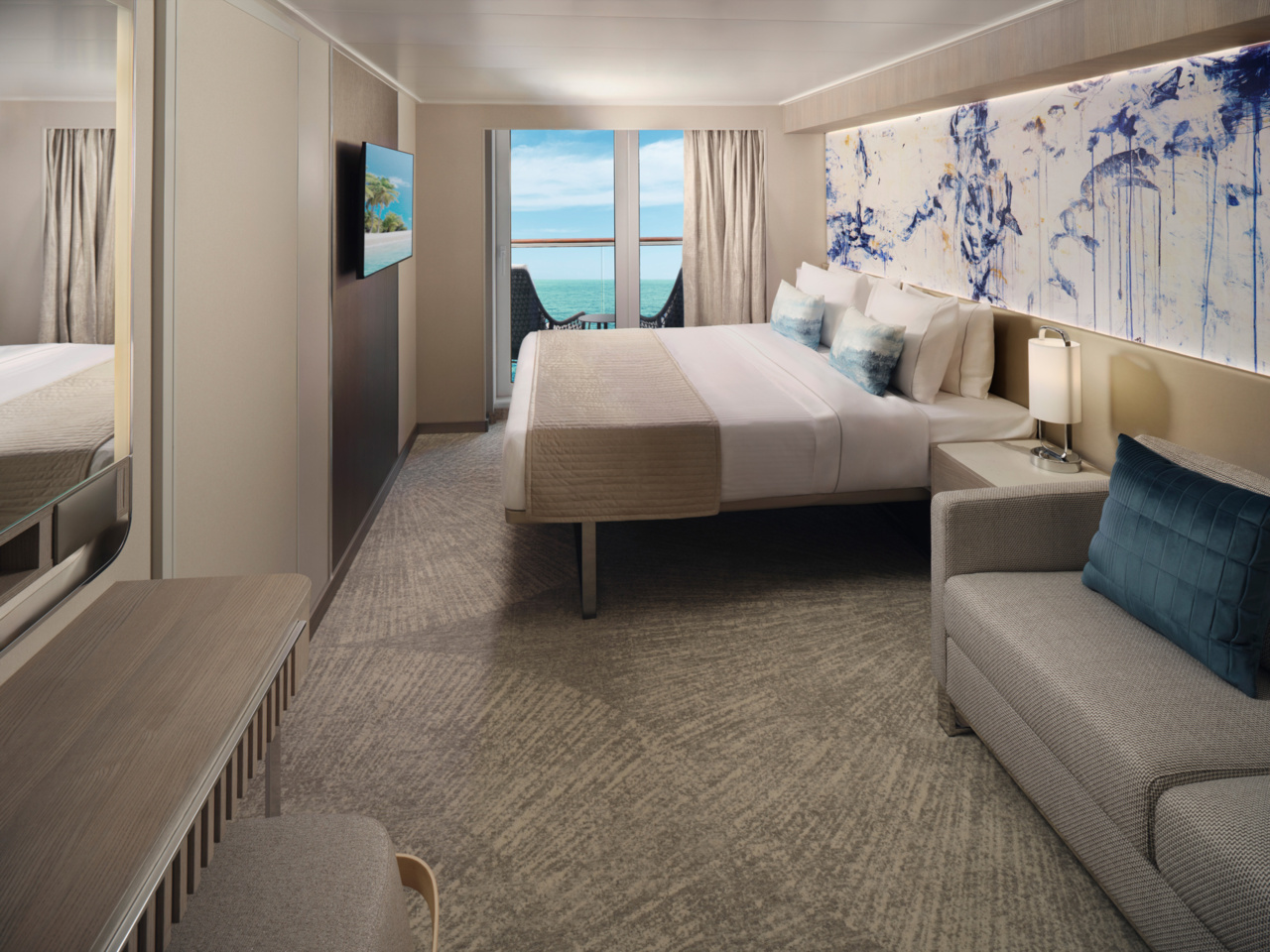 Norwegian Viva balcony suite interior showing modern furnishings and ocean view from private balcony