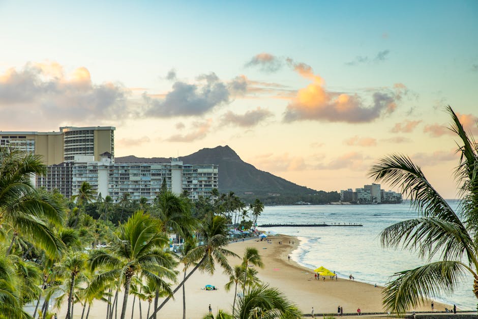Waikiki Beach and Diamond Head crater bathed in warm sunset light, evoking the golden-hour arrival view cruise passengers experience approaching Honolulu from the sea.