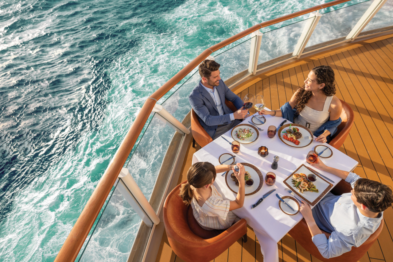 Norwegian Encore Waterfront dining area with ocean views and outdoor seating