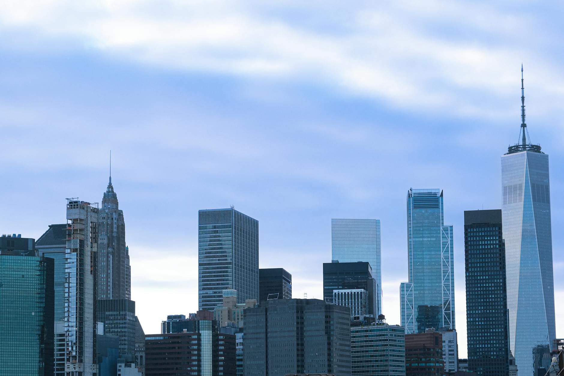 Cruise ship departing from New York Harbor with the Manhattan skyline in the background