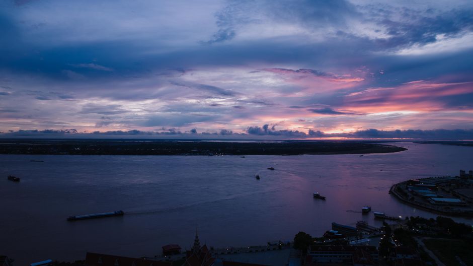 A breathtaking aerial view of sunset over the river in Phnom Penh, Cambodia.
