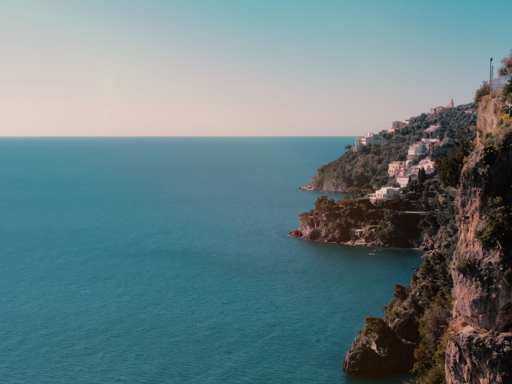 Dramatic cliffside terrain and turquoise waters along Italy's Amalfi Coast, an iconic Western Mediterranean cruise destination
