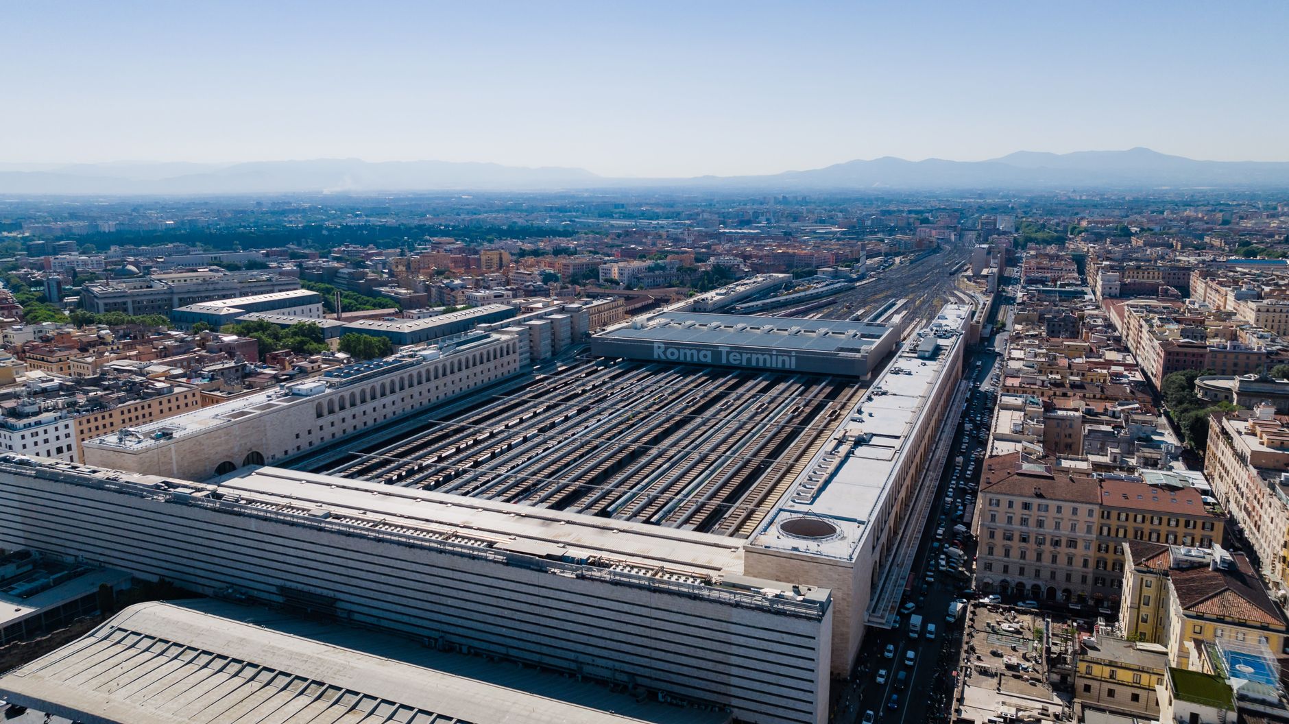 Aerial daytime view of the bustling Roma Termini station, the main departure point for regional trains to Civitavecchia cruise port