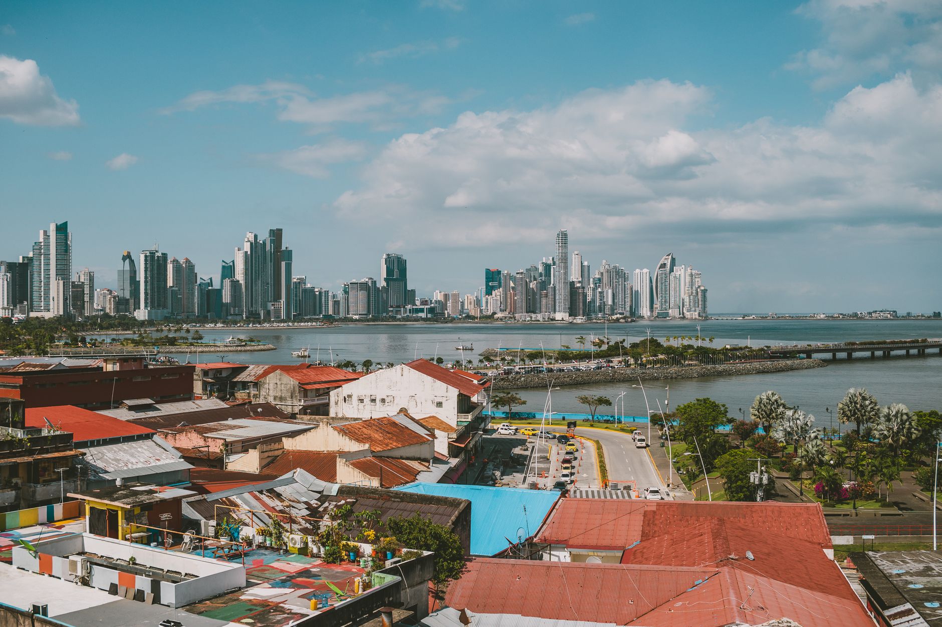 Panama City's modern skyline towers rising behind the historic Casco Viejo district, illustrating the striking contrast between colonial heritage and contemporary cityscape that greets travelers departing from the capital.