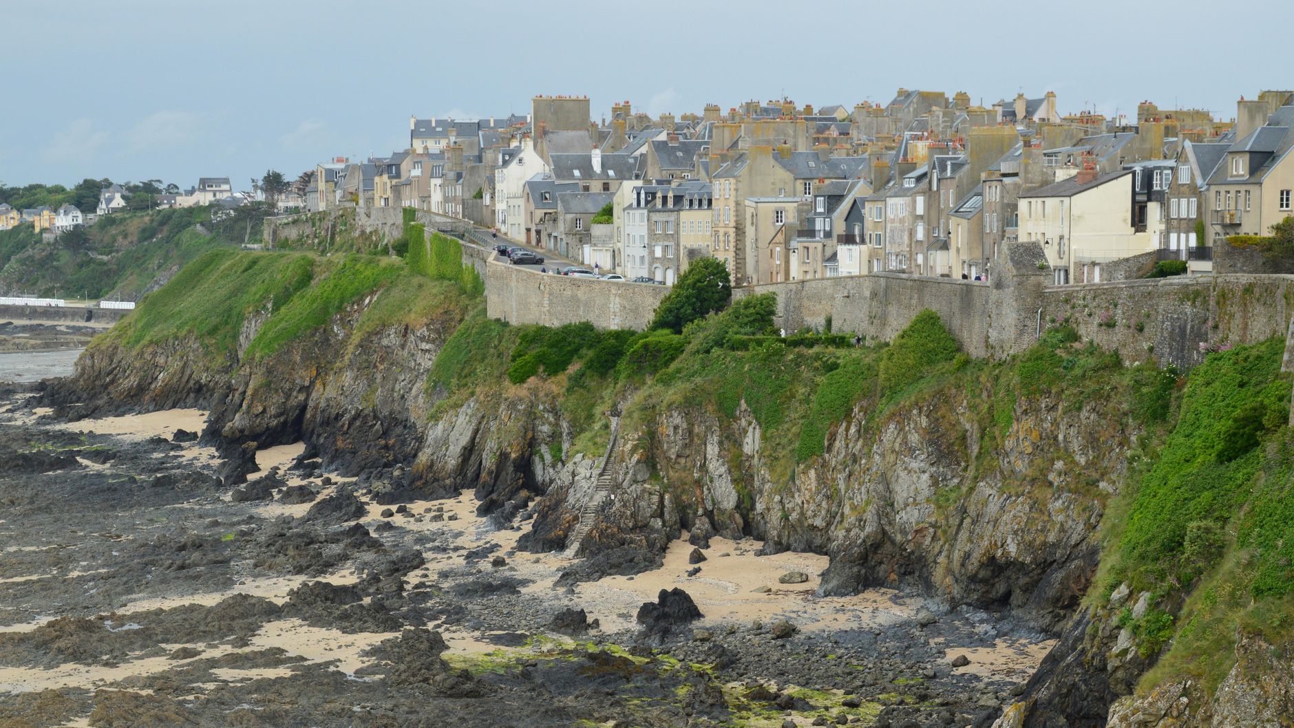 Historic cliffside architecture of Granville, Normandie, a charming Atlantic coastal town along wider European cruise routes.