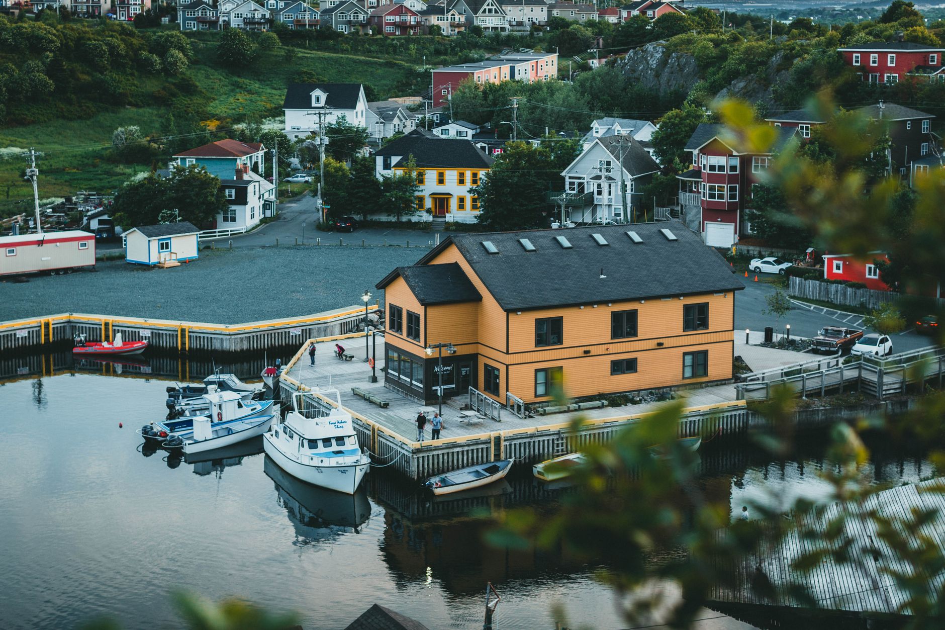 Charming aerial view of Quidi Vidi village and harbor with boats and colorful houses in St. John's, Newfoundland.