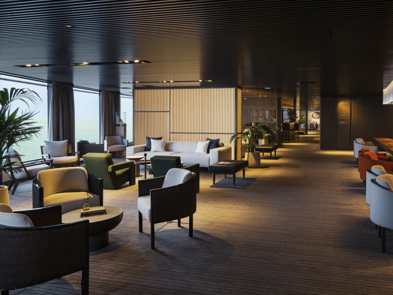 NCL Luna Haven Lounge with elegant seating and ocean views during a sea day.