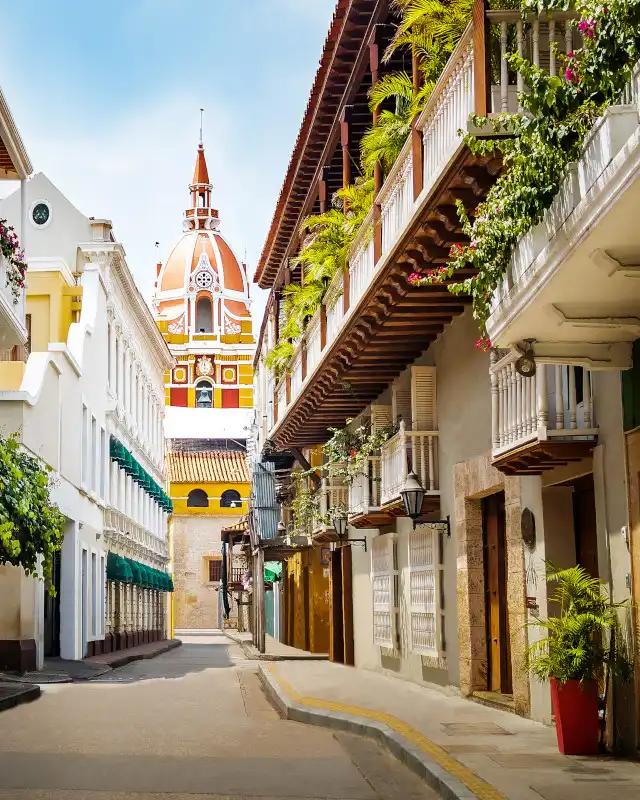 Colonial architecture and cathedral dome in Cartagena de Indias at dusk, showcasing the historic Walled City's Caribbean charm.