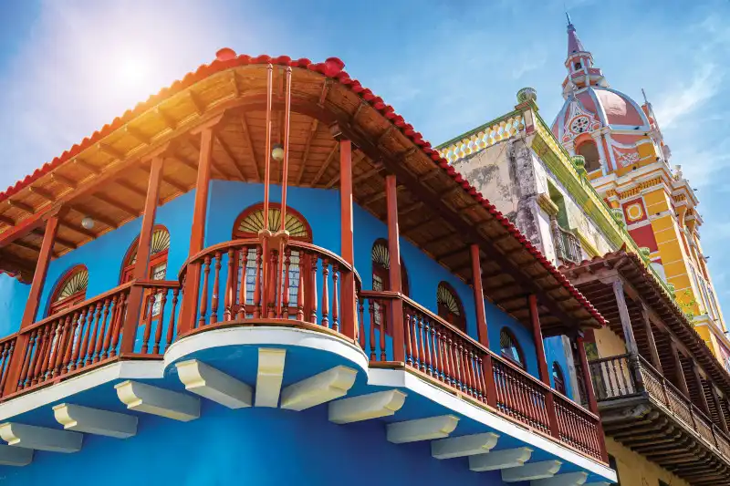 Colonial architecture and street scene in Cartagena's UNESCO Walled City with historic buildings and cultural heritage elements.