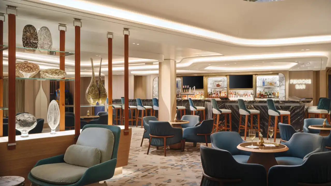 Norwegian Viva Penrose Bar featuring multi-level atrium architecture with warm lighting and generous seating arrangement.