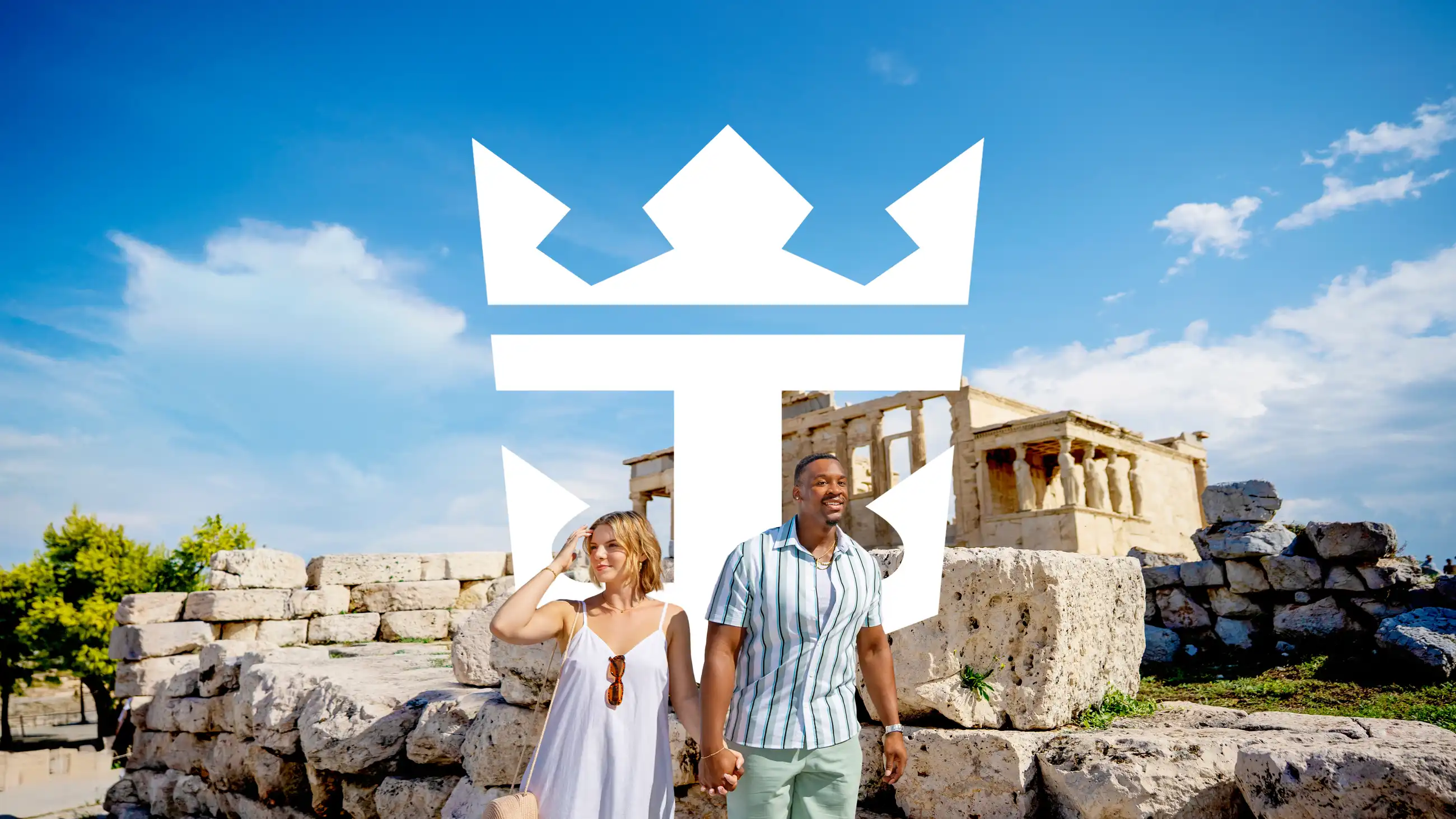 A couple stands hand in hand before the columns of the Erechtheion on the Acropolis in Athens, with a Royal Caribbean Crown and Anchor mark overlaid.