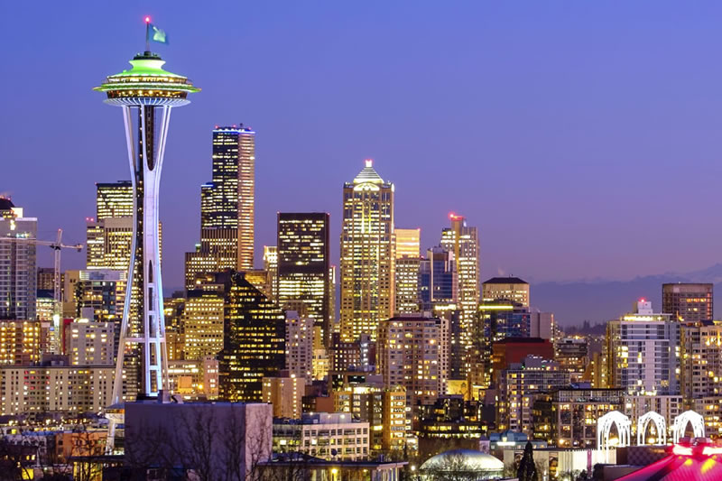 Seattle skyline at night with illuminated Space Needle and downtown skyscrapers
