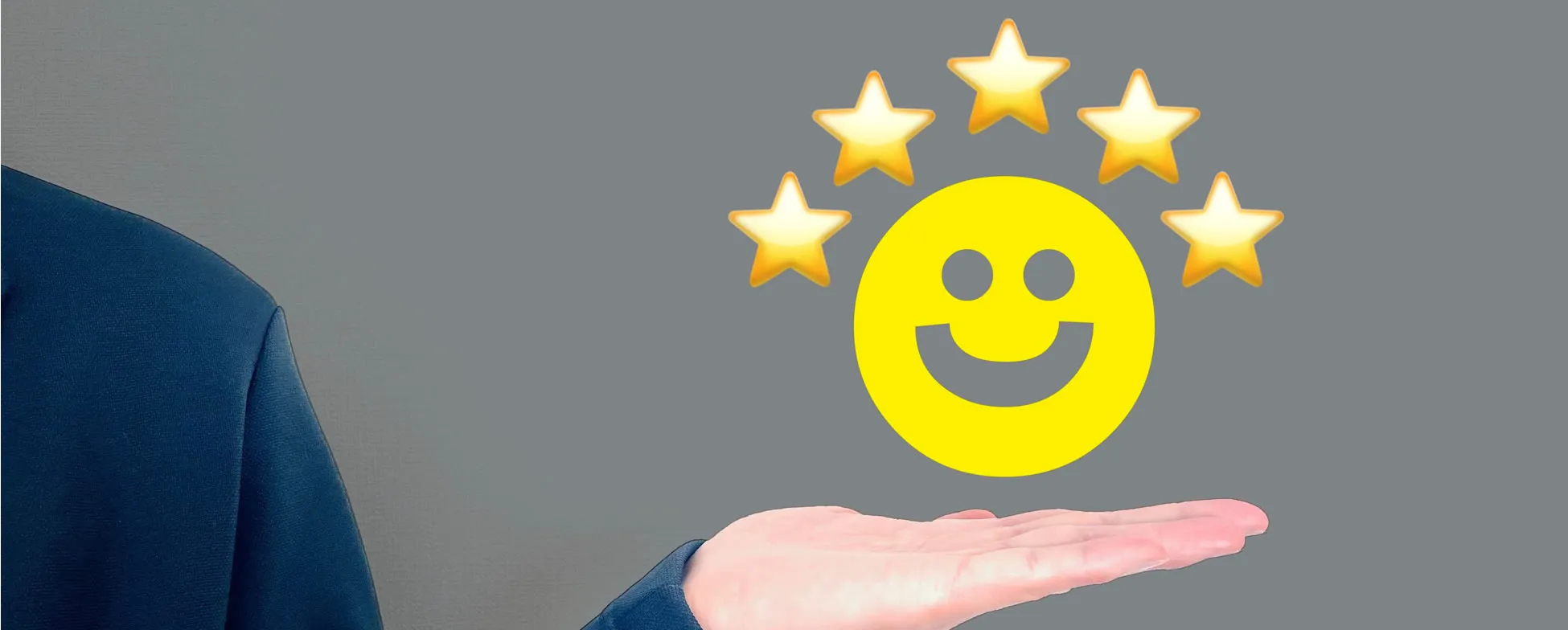 Smiling yellow emoji with five gold stars above an open palm
