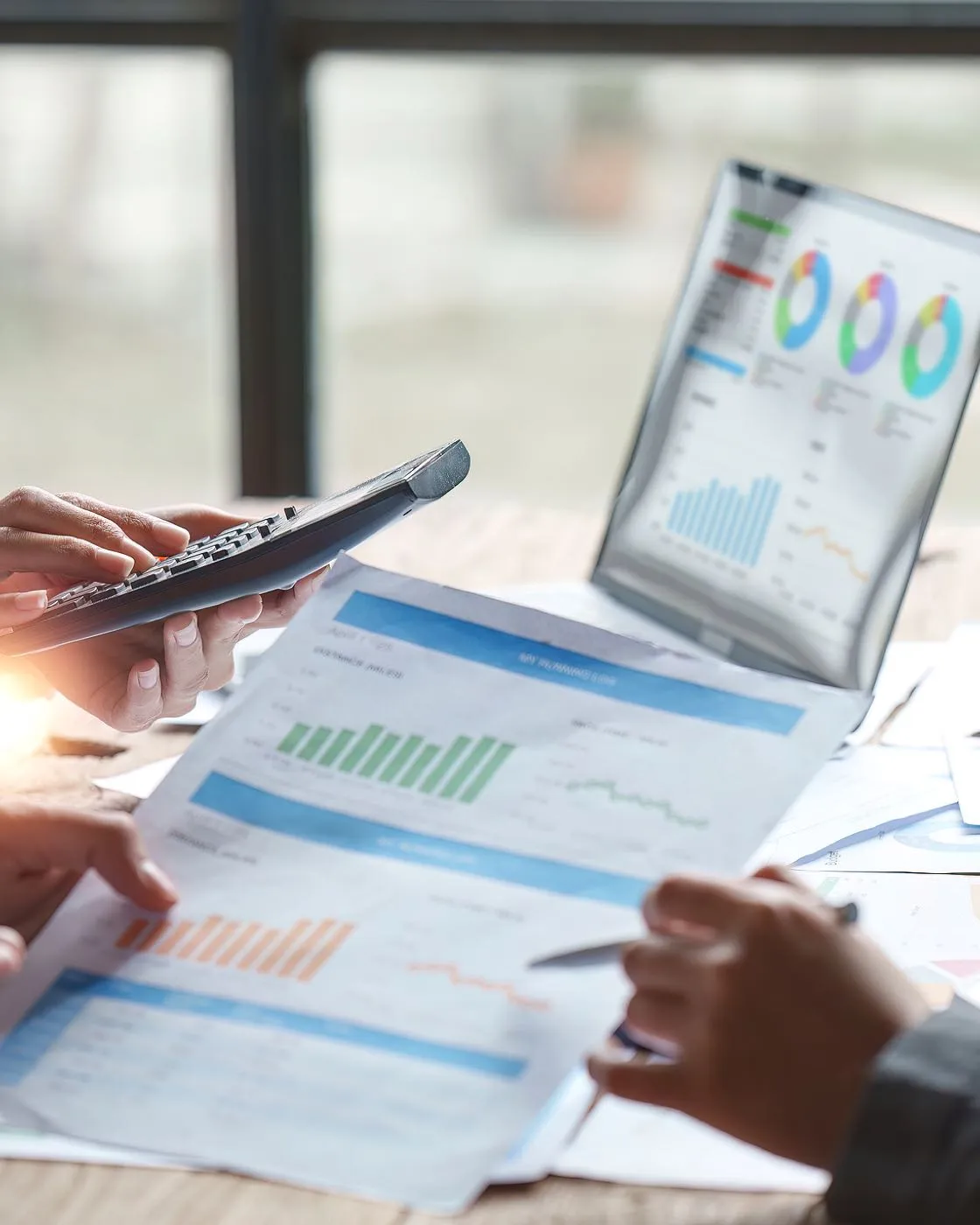 business meeting with charts on table