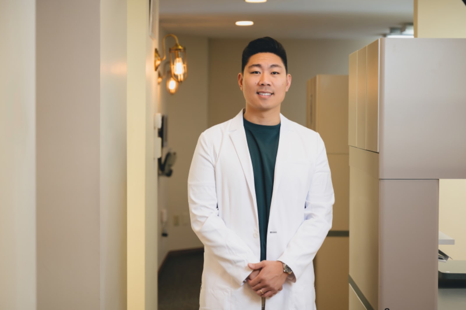 Professional dentist in white coat ready for patient evaluation