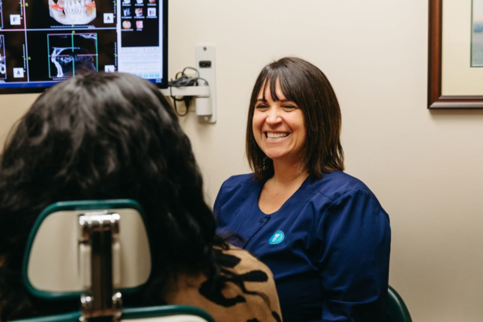 Doctor discussing treatment plan with patient in clinical office