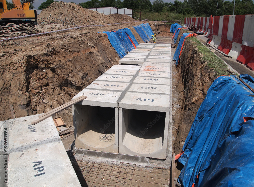 Precast concrete box culvert drain lay at the construction site. it is used  to channel storm water to the nearest monsoon drain. Stock Photo | Adobe  Stock