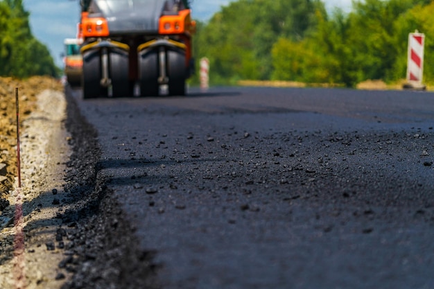 Premium Photo | Industrial pavement truck Laying fresh asphalt on  construction site Heavy machine industry Mechanical engineering