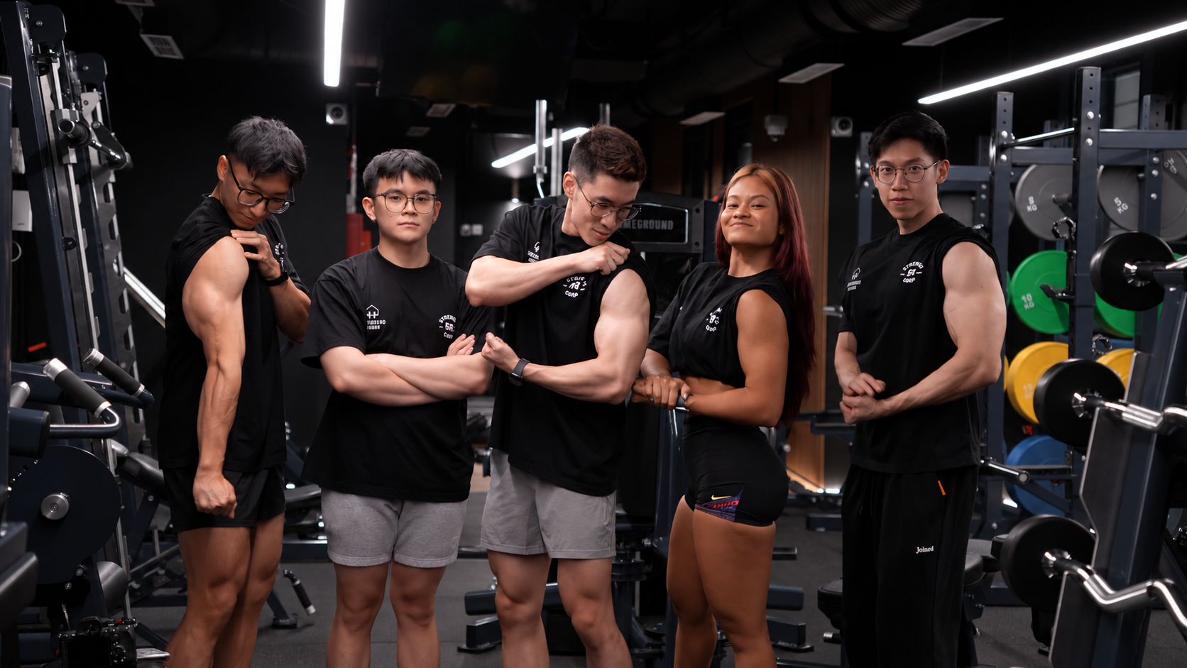 Strength Corp coaching team together inside the gym