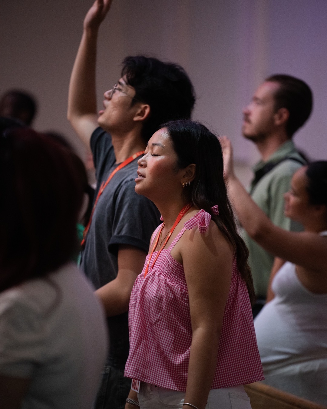 Young adults in worship at C3 Assembly
