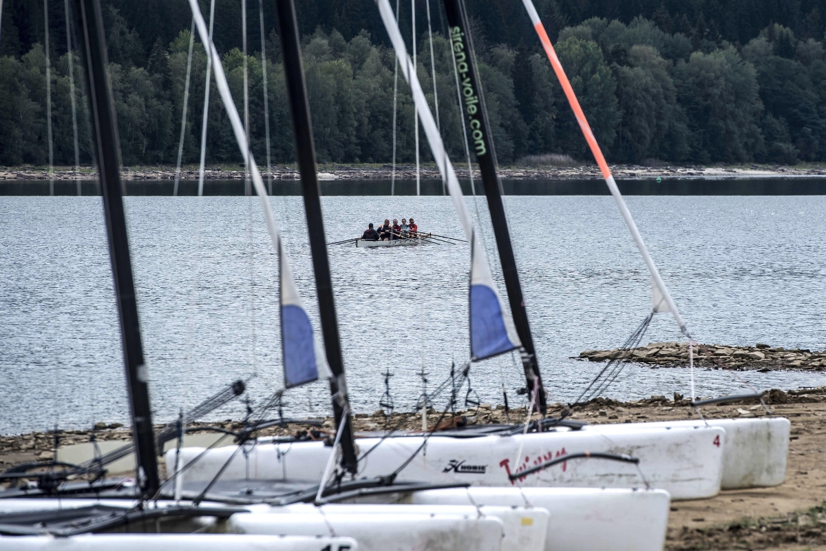 Catamarans ready on the shore of Lipno Lake