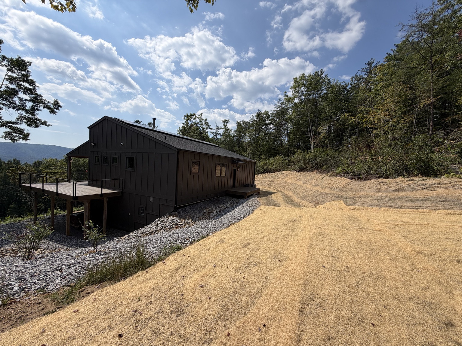 Wide finished view of the permanent erosion control system around the Ferguson mountain home