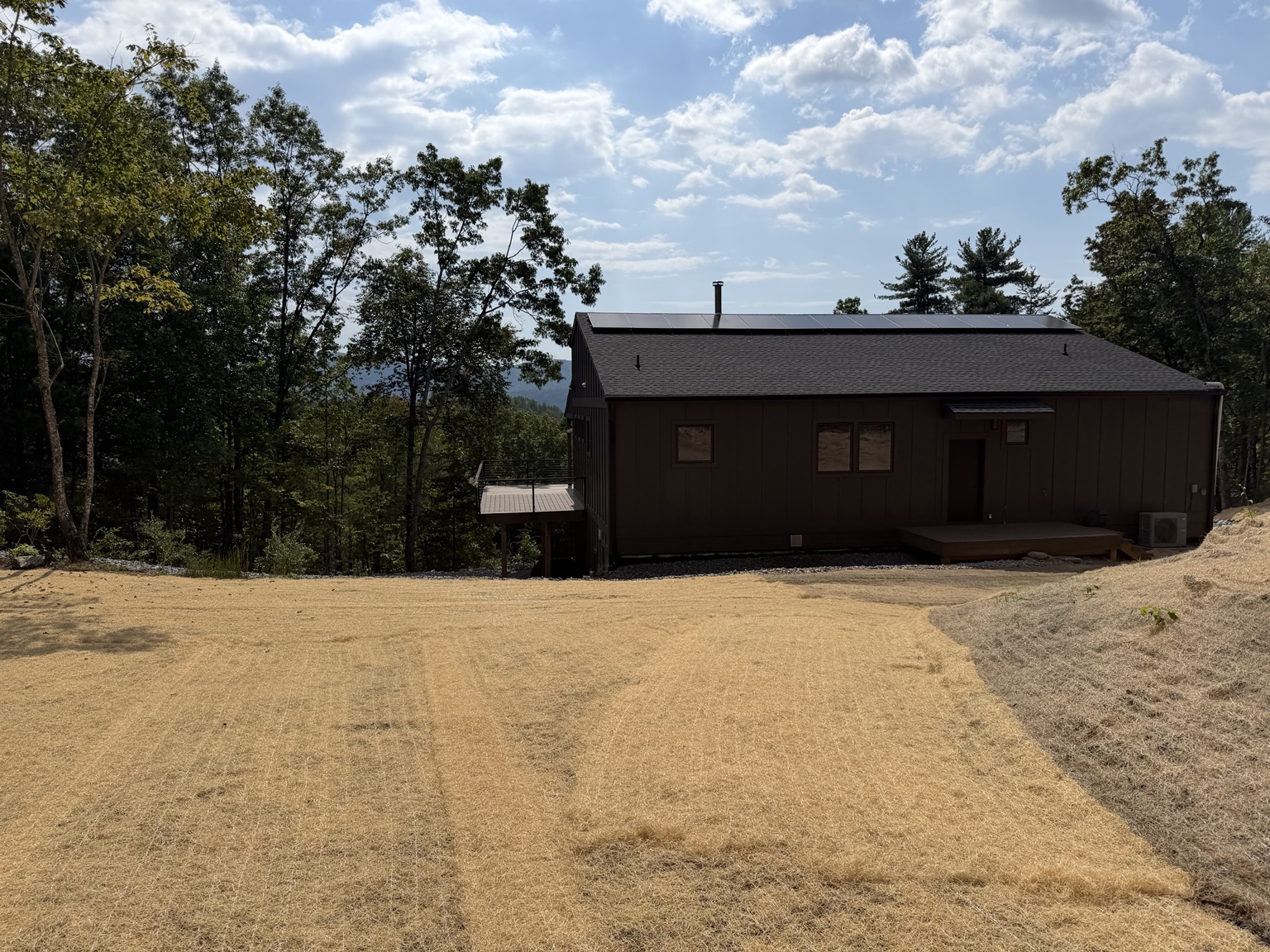 Finished erosion matting and drainage grading behind the Ferguson home