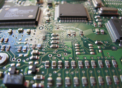 Close-up of a textured honeycomb pattern sheet with adhesive on the edges on a black surface.