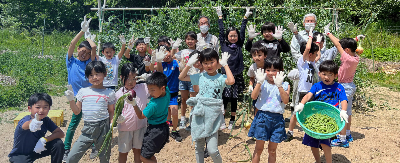 Group of children in a vegetable garden