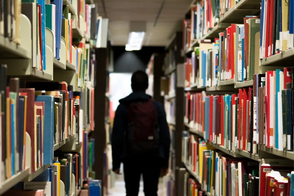 Student studying at a desk — external assessments contribute 25–50% of Year 12 General subject results