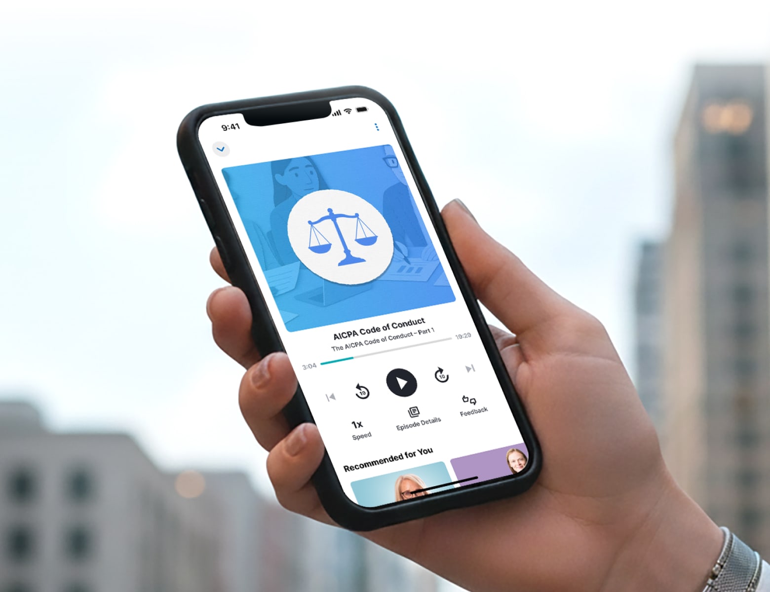 Hand holding a mobile device showing the LumiQ mobile app