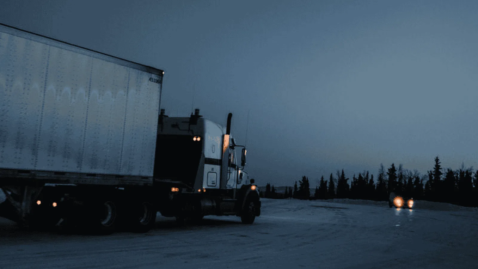 Semi‑truck glowing at dawn, capturing the quiet confidence and freedom that come with lease‑purchase independence.