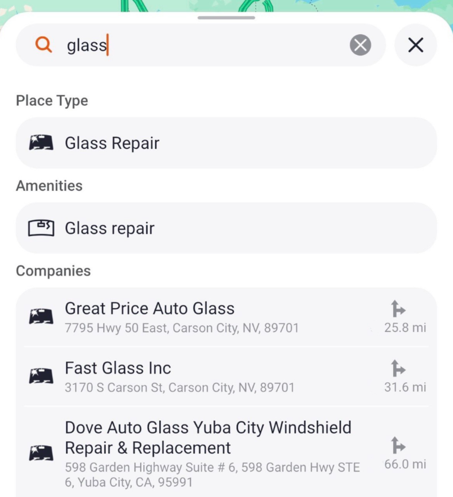 Trucker Guide showing relevant windshield repair search suggestions and matching service locations on the map.