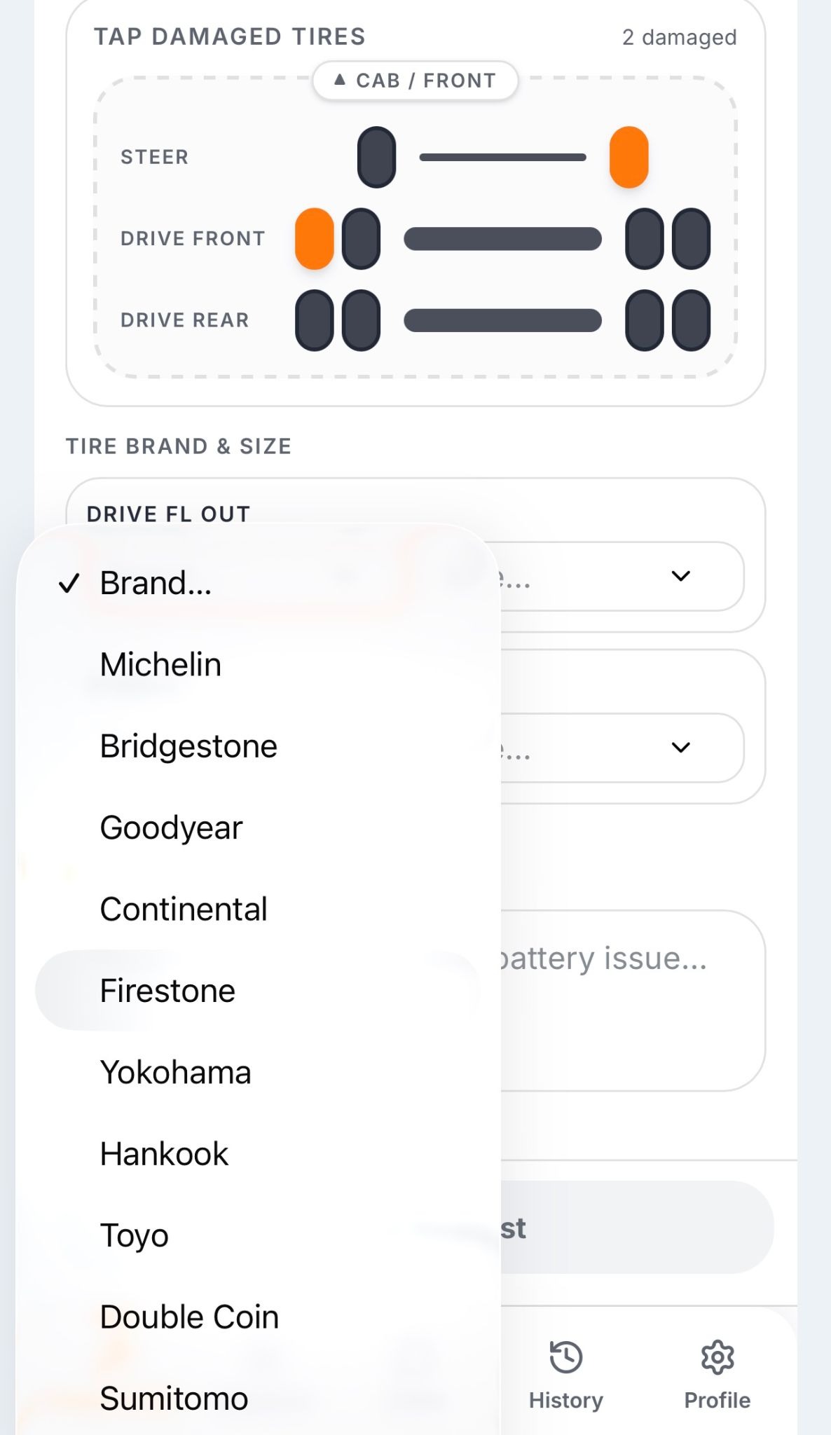 Trucker Guide Roadside Assistance screen for selecting tire brand and size details.