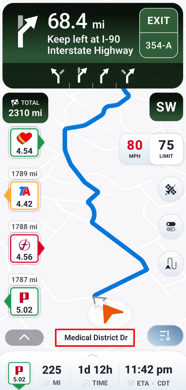 Trucker Guide navigation screen displaying the current road name during a trip
