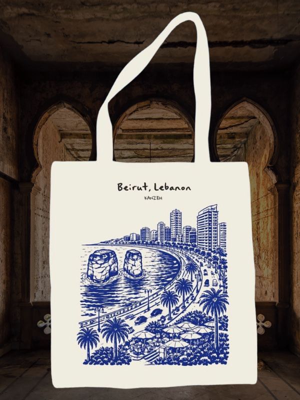 Beirut, Lebanon tote bag with blue line art of coastline, sea rocks, palm trees, and city skyline.