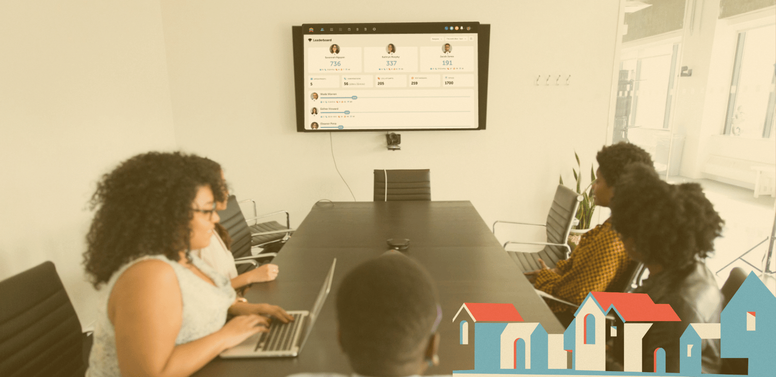Real estate team meeting around a conference table with a Follow Up Boss leaderboard on the wall screen