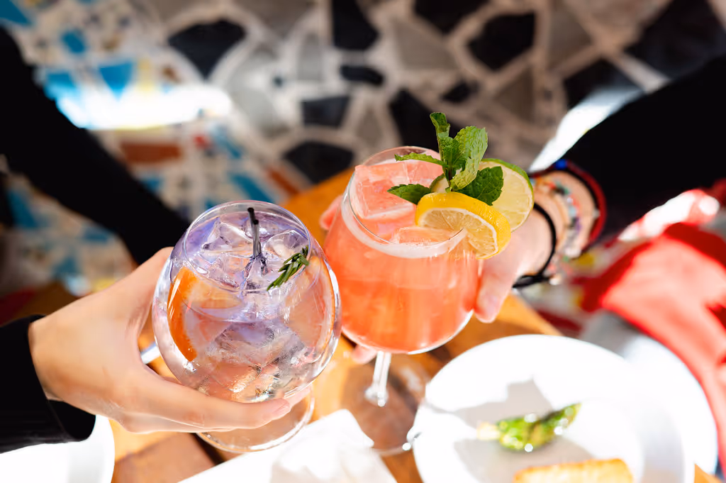 Cheers with drinks at Toro Kitchen and Bar