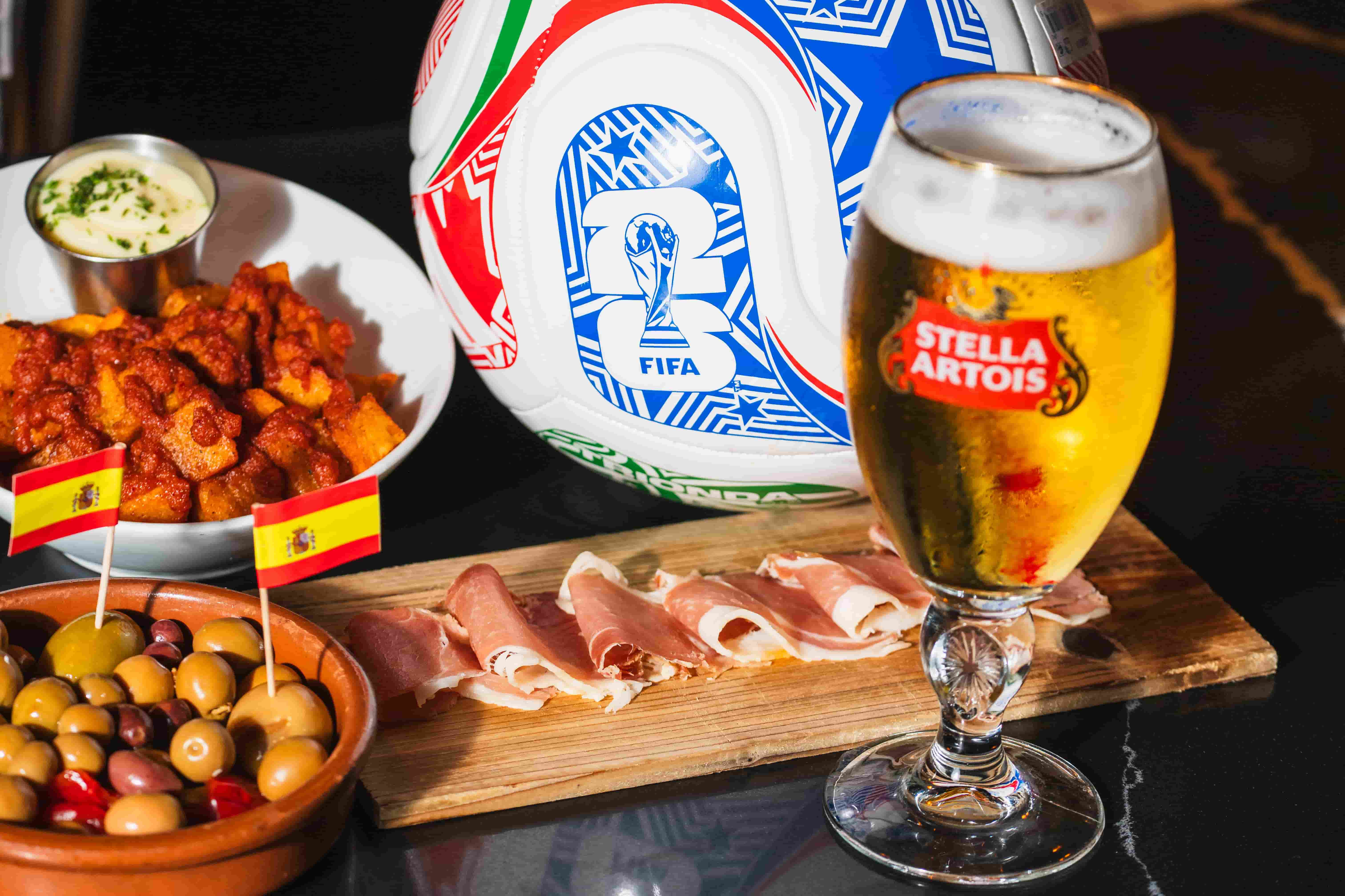 Bar special: Stella draft, potato chips, jamón, olives