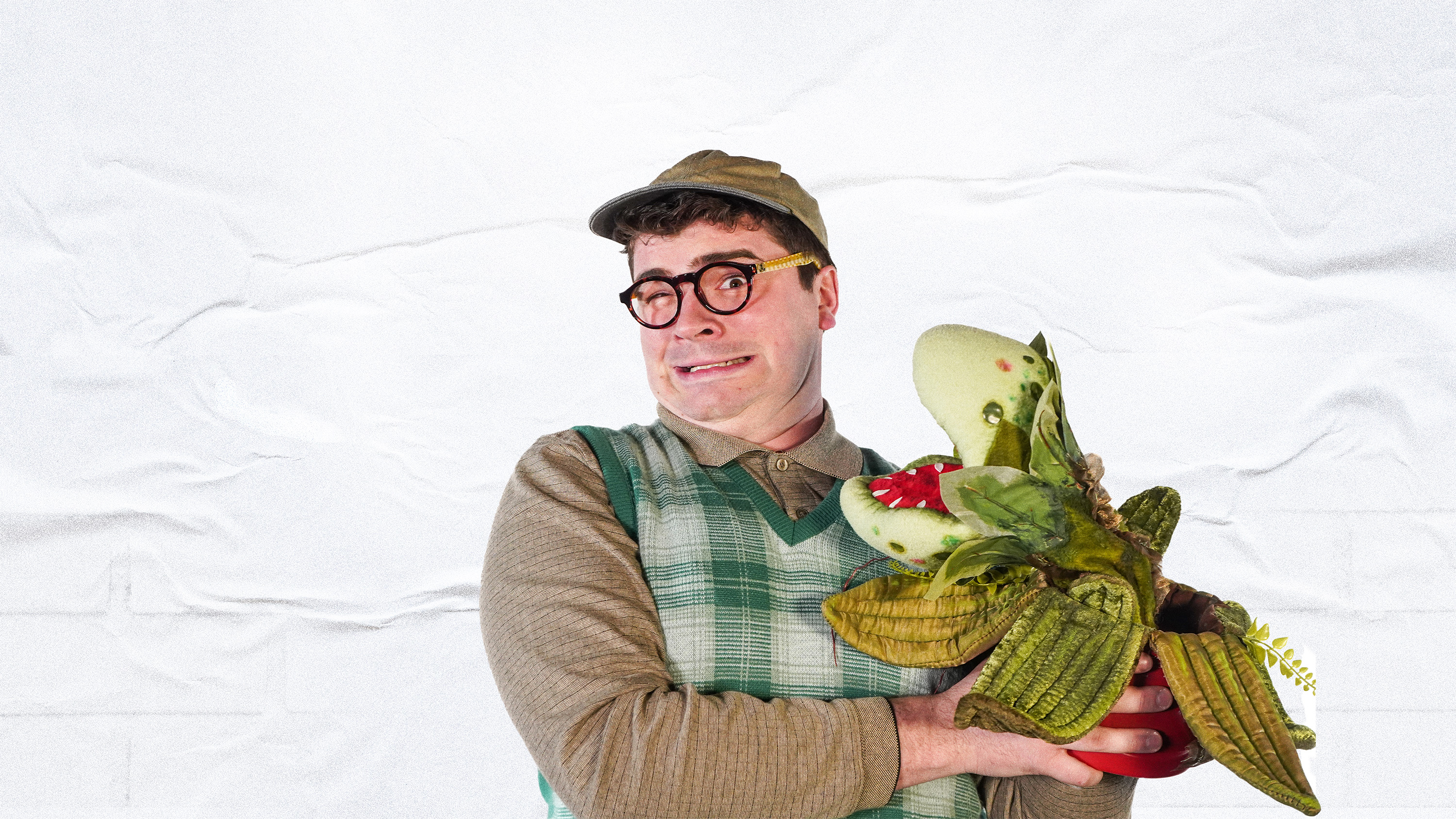 A dramatic shot of Wendesday Addams from behind with purple fog all around