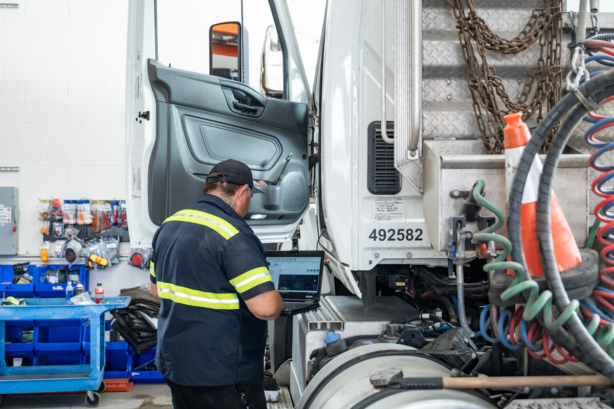 mechanic looking at diagnostics