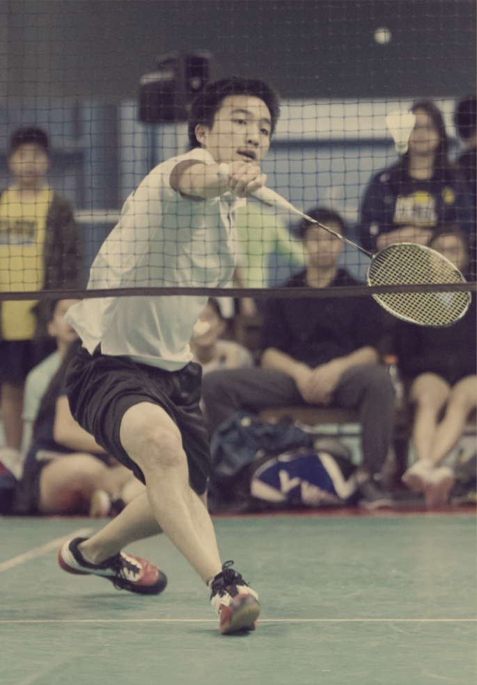 Will Cheung hitting a backhand front net shot