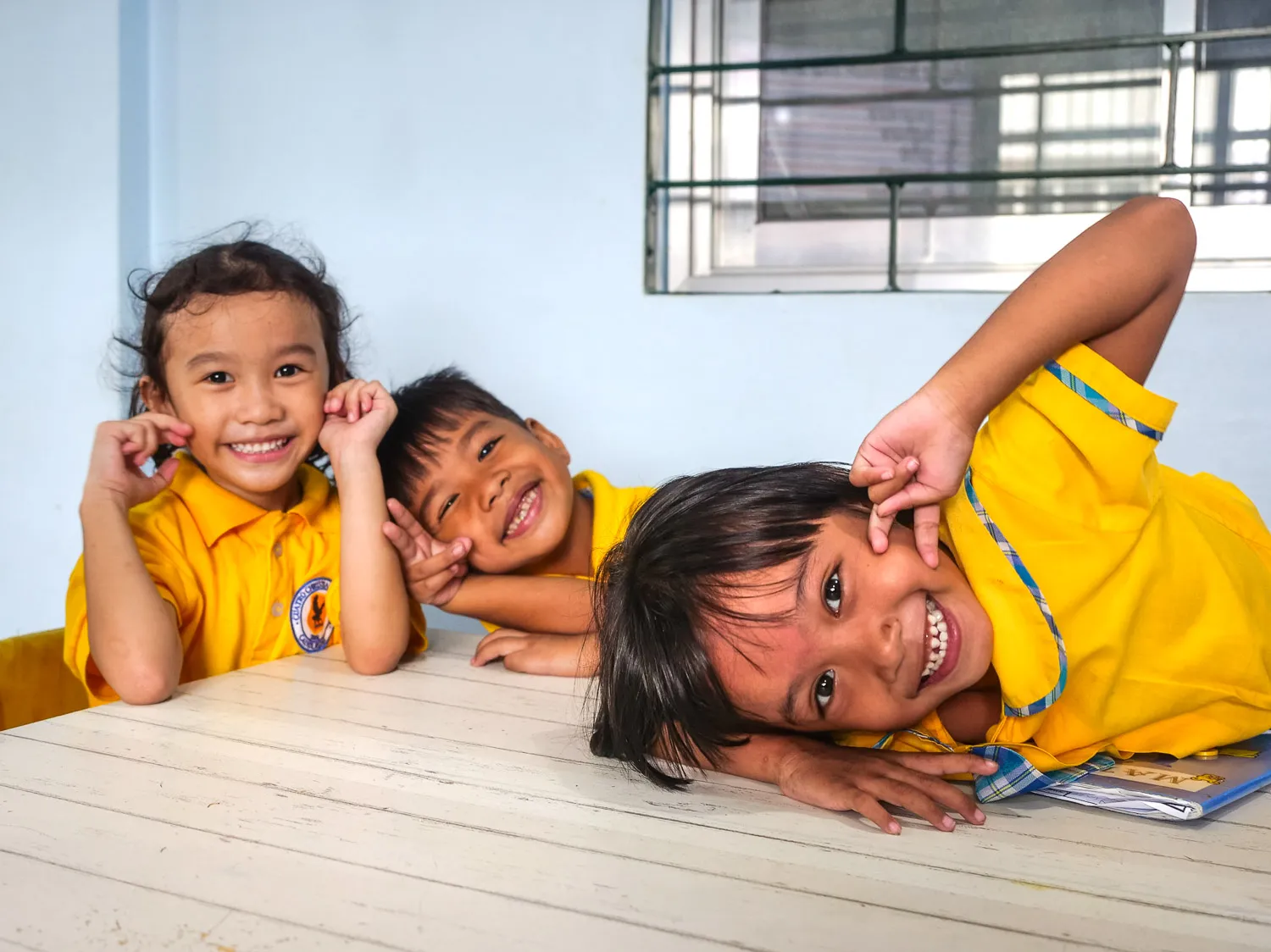 Smiles of some three first graders.