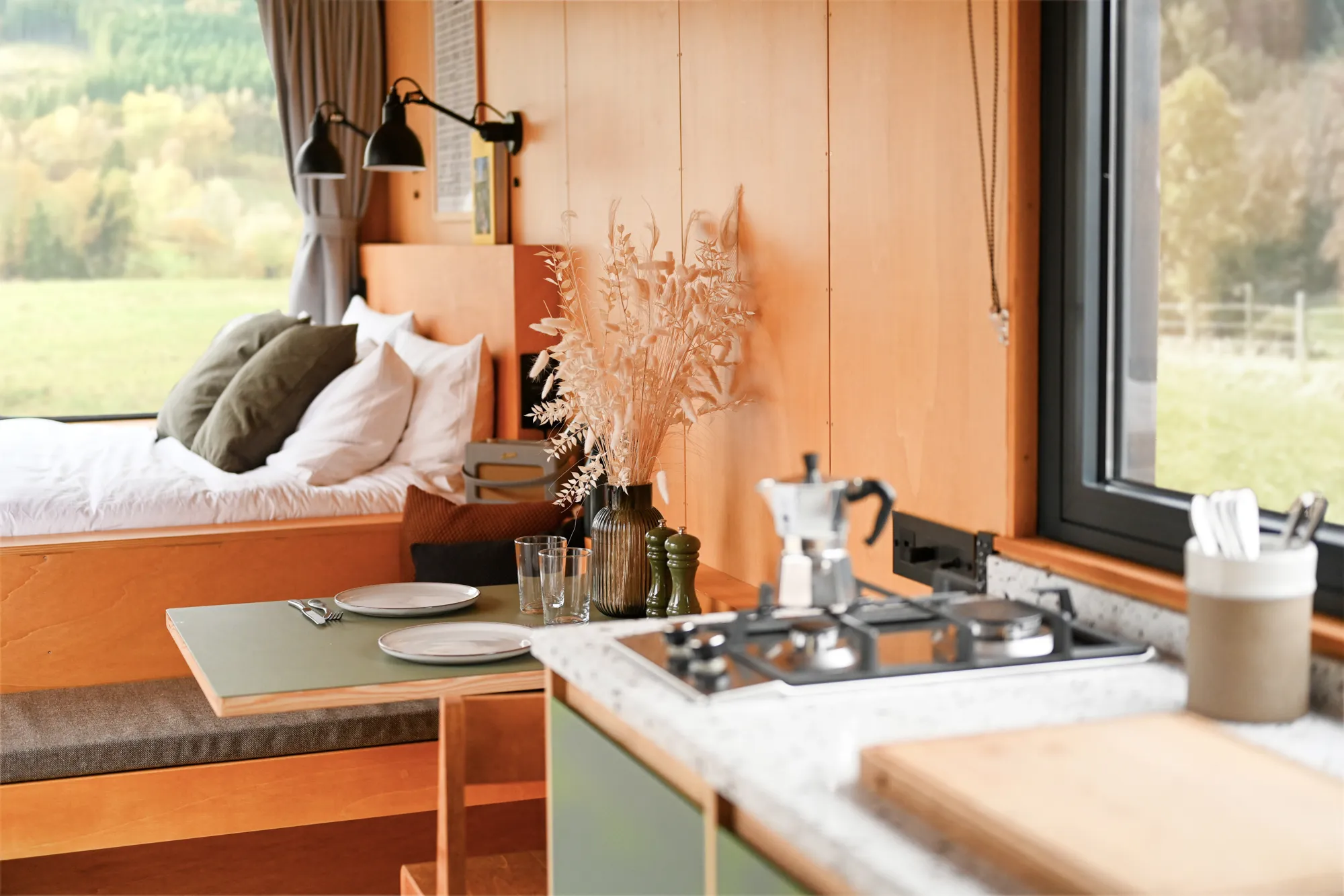 Offgrid cabin interior with a kitchen and a fire place