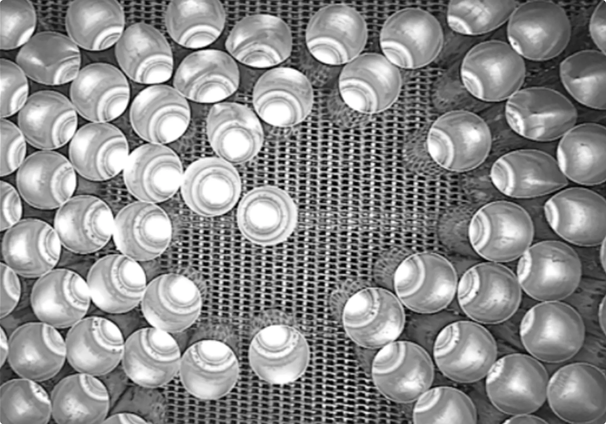 MassInspect system view, top down look into open aluminum cans on the production line.