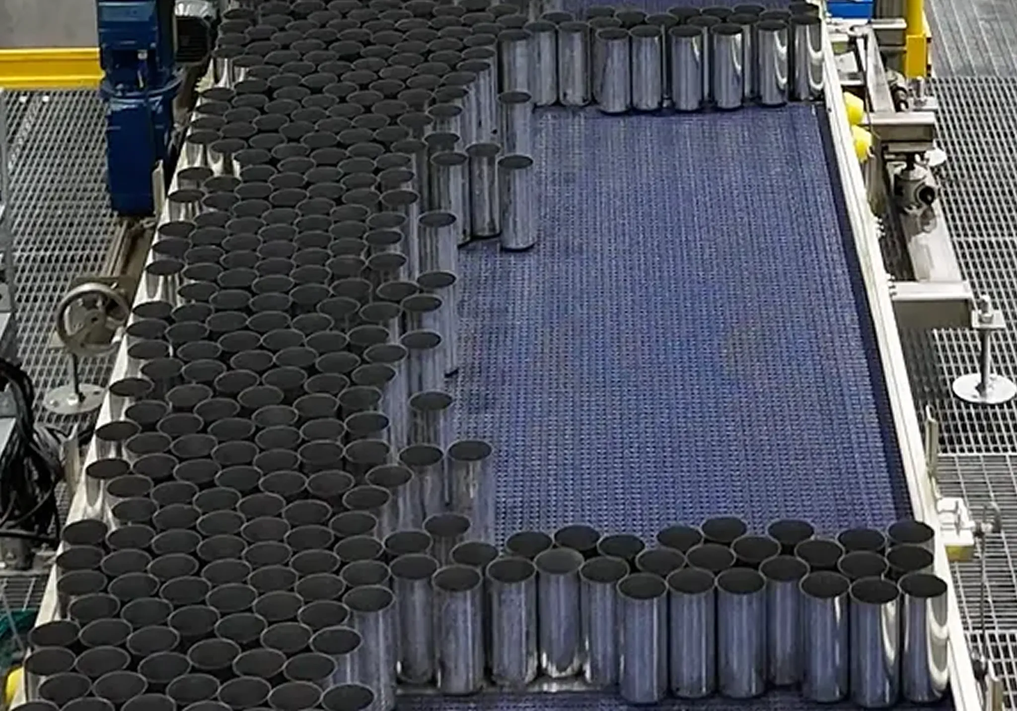 MassInspect system inspection location. This is a production line with aluminum cans open at the top.