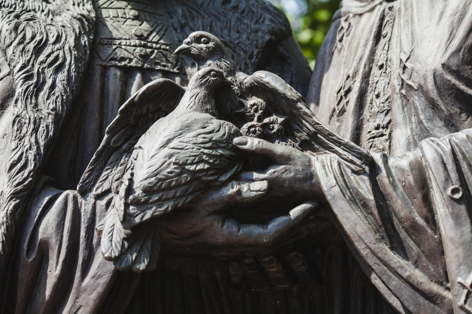 Works of the Flesh – detailed sculpture of birds in hands